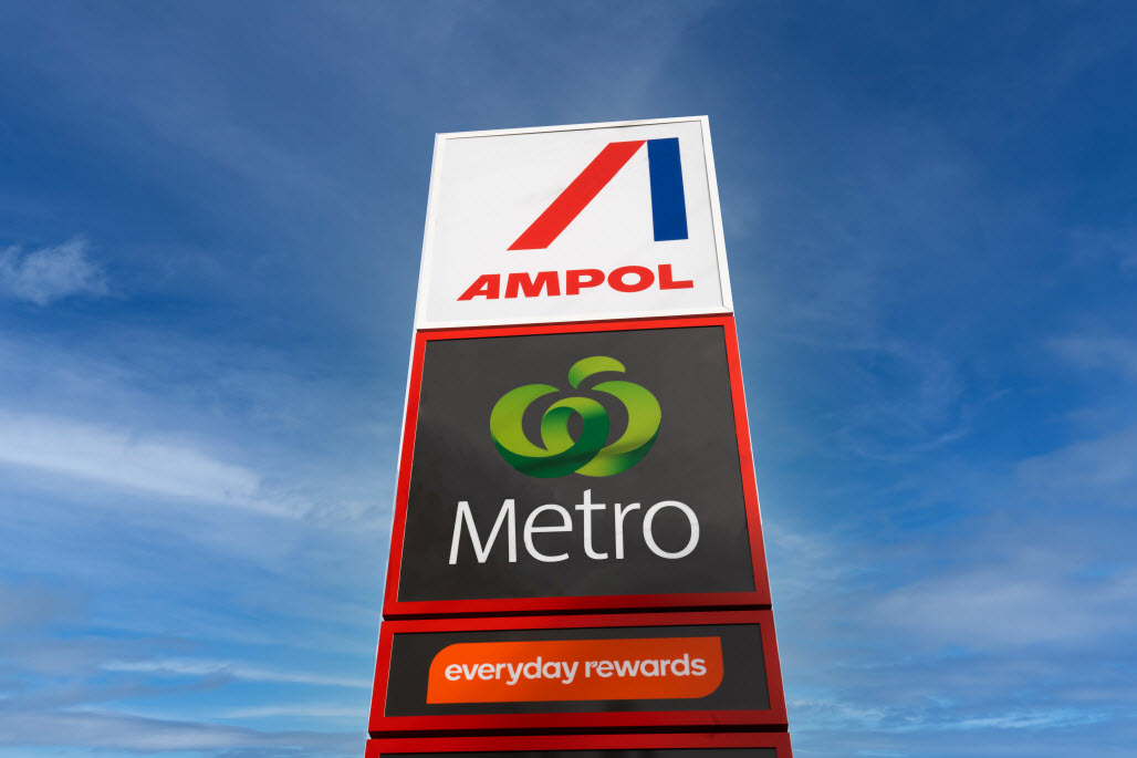 An Ampol Woolworths Metro petrol station sign